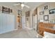 Hallway with multiple doors, decorative art, and access to the bathroom and closet at 565 Osprey Landing Dr, Lakeland, FL 33813