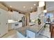 Bright kitchen with white cabinetry, granite countertops, stainless steel appliances, and a breakfast bar at 565 Osprey Landing Dr, Lakeland, FL 33813