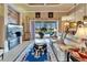 Inviting living room with a bright interior and sliding glass doors that lead to the pool area at 565 Osprey Landing Dr, Lakeland, FL 33813