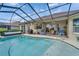 Beautiful screened-in pool area with ample seating, perfect for relaxation and outdoor enjoyment at 565 Osprey Landing Dr, Lakeland, FL 33813