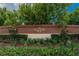 Eaglebrooke community brick signage with manicured landscaping and mature shade trees at 565 Osprey Landing Dr, Lakeland, FL 33813