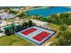 Overhead shot of community tennis courts, with lake and golf course in the background at 565 Osprey Landing Dr, Lakeland, FL 33813