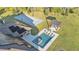 Aerial view of a backyard with a pool, pergola with a firepit, and basketball court at 5676 Case Ln, Lakeland, FL 33813