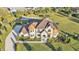 Sweeping aerial shot showcasing the gorgeous property with manicured lawns, a basketball court, and a pool area at 5676 Case Ln, Lakeland, FL 33813