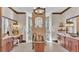 Luxury bathroom featuring a standalone copper tub, dual vanities, and a walk-in shower with dual shower heads at 5676 Case Ln, Lakeland, FL 33813
