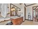 Bathroom with wood vanity, vessel sink, and a large framed mirror at 5676 Case Ln, Lakeland, FL 33813