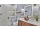 Stylish bathroom with a glass-enclosed shower, modern vanity, and unique decor at 5676 Case Ln, Lakeland, FL 33813