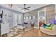 Well-decorated bedroom with wood accent wall, en-suite bathroom, and comfortable seating at 5676 Case Ln, Lakeland, FL 33813