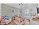Bright bedroom featuring wood accent wall, large window, and vaulted ceiling at 5676 Case Ln, Lakeland, FL 33813