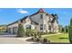 A stunning home with manicured landscaping, stone accents, and a three-car garage, offers curb appeal and practicality at 5676 Case Ln, Lakeland, FL 33813