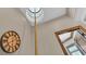 Elegant foyer showcases a circular skylight, a statement clock, and rich wood trim, creating a grand entrance at 5676 Case Ln, Lakeland, FL 33813