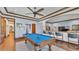 Spacious game room includes a pool table, wet bar, and cozy seating, perfect for entertaining and relaxation at 5676 Case Ln, Lakeland, FL 33813