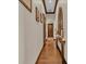 Hallway featuring wood floors, stylish trim, and custom decor at 5676 Case Ln, Lakeland, FL 33813