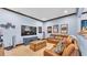 Comfortable home theater with leather seating, a large screen television, and movie-themed decor at 5676 Case Ln, Lakeland, FL 33813