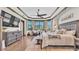 Spacious main bedroom with a beamed ceiling, bay windows, and a decorative stone accent wall at 5676 Case Ln, Lakeland, FL 33813
