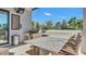 Entertain in the screened patio with an outdoor kitchen, a built-in grill, and a stunning granite bar top at 5676 Case Ln, Lakeland, FL 33813