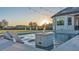 Enjoy a relaxing day with a sunset view on the pool's tanning ledge, integrated spa and fire bowls at 5676 Case Ln, Lakeland, FL 33813