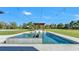 Beautiful pool with integrated spa and pergola in a large backyard setting at 5676 Case Ln, Lakeland, FL 33813