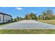 Private backyard basketball court, ideal for sports and recreation, set against lush landscaping at 5676 Case Ln, Lakeland, FL 33813