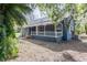 Exterior view of a blue home with a covered front porch at 6029 Tancrede Ct, Lakeland, FL 33811