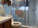 The bathroom features a tiled floor and a glass-enclosed shower with tiled walls at 6059 Swallow Dr, Lakeland, FL 33809