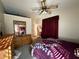 A brightly lit bedroom features coordinating furniture and a glimpse into an adjoining room at 6059 Swallow Dr, Lakeland, FL 33809