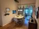 Dining room with wood floors, modern furniture, and view of the living room at 6059 Swallow Dr, Lakeland, FL 33809