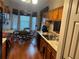 Kitchen and dining area with wood cabinets, stainless steel sink, and a dining table with seating for four at 6059 Swallow Dr, Lakeland, FL 33809