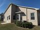 Back exterior of the home showcasing its design and well-maintained landscaping at 6059 Swallow Dr, Lakeland, FL 33809
