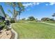 Scenic golf course view from the property with lush greenery and clear blue skies at 6217 Peacock Run, Lakeland, FL 33809