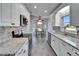 Beautiful kitchen with white cabinets, stainless appliances, and granite countertops at 6217 Peacock Run, Lakeland, FL 33809