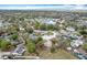 Wide aerial view of home and neighborhood, showcasing its proximity to a scenic pond at 6305 Tocobega Dr, Lakeland, FL 33813