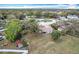 Aerial view showcasing the home's location within a lush, established neighborhood at 6305 Tocobega Dr, Lakeland, FL 33813