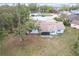 Aerial view of the home showing backyard and screened in porch at 6305 Tocobega Dr, Lakeland, FL 33813