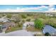A high angle view of a modest home with a spacious yard at 6305 Tocobega Dr, Lakeland, FL 33813