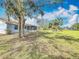 Spacious, fenced backyard with mature landscaping provides privacy at 6305 Tocobega Dr, Lakeland, FL 33813