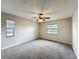 Large bedroom featuring a ceiling fan and multiple windows for natural light at 6305 Tocobega Dr, Lakeland, FL 33813