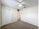 Neutral bedroom featuring a ceiling fan and closet at 6305 Tocobega Dr, Lakeland, FL 33813