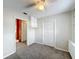 Neutral bedroom with carpet and access to the en-suite bathroom and closet at 6305 Tocobega Dr, Lakeland, FL 33813