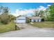Charming single-Gathering home with a well-manicured lawn and attached two-car garage at 6305 Tocobega Dr, Lakeland, FL 33813