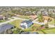 An aerial view of a two-story home surrounded by well-maintained lawns and lush trees at 6421 Highlands Oak Trl, Lakeland, FL 33813