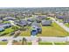 Aerial view of the home with a large front lawn at 6421 Highlands Oak Trl, Lakeland, FL 33813