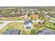 Aerial shot of a home showcasing its backyard and neighborhood at 6421 Highlands Oak Trl, Lakeland, FL 33813