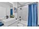 Modern bathroom features white marble tile, stylish fixtures, and a vessel sink with a rainfall shower at 6421 Highlands Oak Trl, Lakeland, FL 33813