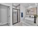 Modern bathroom features a sleek glass shower enclosure and vessel sink at 6421 Highlands Oak Trl, Lakeland, FL 33813