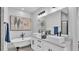 Elegant bathroom with dual vessel sinks, a clawfoot tub, and modern fixtures at 6421 Highlands Oak Trl, Lakeland, FL 33813