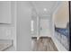 Inviting entryway with light gray walls, wood-look tile flooring, leading to the main living areas at 6421 Highlands Oak Trl, Lakeland, FL 33813