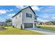 Front exterior of house with driveway and well-manicured lawn at 6421 Highlands Oak Trl, Lakeland, FL 33813