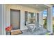 Front porch with chairs and 'Welcome' door mat at 6421 Highlands Oak Trl, Lakeland, FL 33813