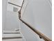 Classic staircase with white risers, wood treads, and elegant wooden handrail, leading to the upper level at 6421 Highlands Oak Trl, Lakeland, FL 33813